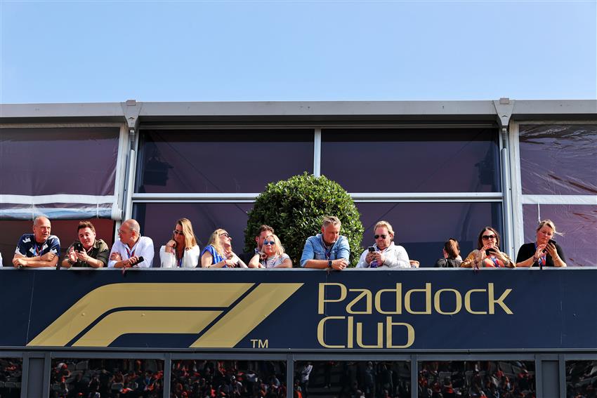 Paddock club fans watching the race