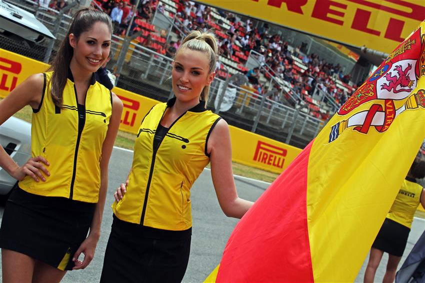 Two Spanish girls holding flags
