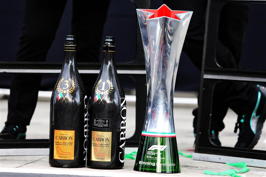 Two bottles of champagne and trophy